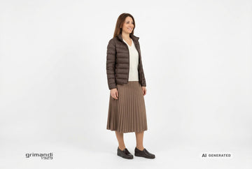 Mocassini Melluso donna indossati con piumino nylon cioccolato, pullover cashmere panna e gonna midi plisse moka. Outfit 2