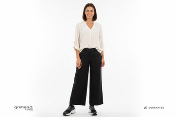 CafeNoir Jeans sneaker slip-on nera knit con fascia strass cristalli platform bianca abbinata a pantalone palazzo lino nero e blusa viscosa per look casual sofisticato - AI-Generated Model