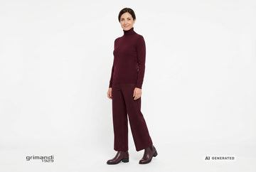 Stivaletti Melluso donna indossati con dolcevita in puro cashmere bordeaux e pantaloni palazzo coordinati in panno morbido. Outfit 2